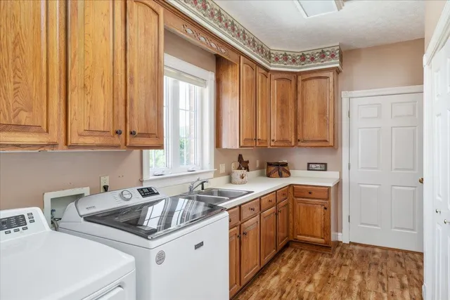 a view of a livingroom with furniture and floor to ceiling window