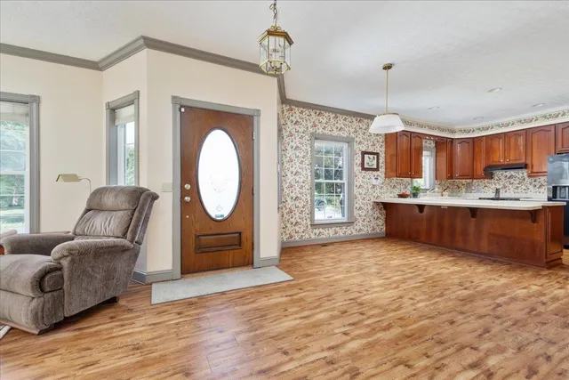a bathroom with a granite countertop sink a toilet and a bathtub