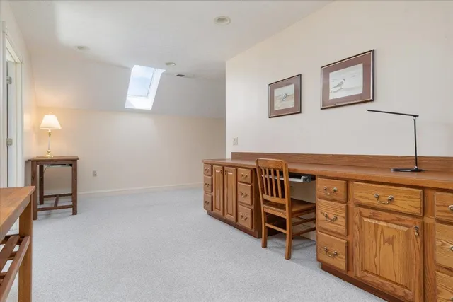 a bath tub sitting in a bathroom next to a window