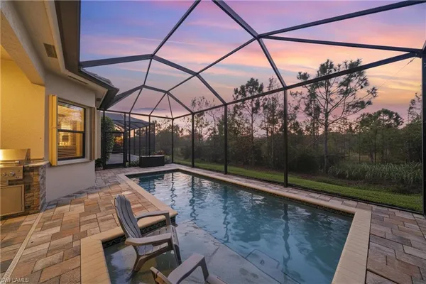 a view of a balcony with couch and wooden floor