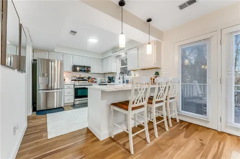 a view of a dining room with furniture