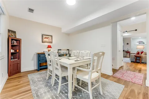 a view of a bedroom with wooden floor and staircase