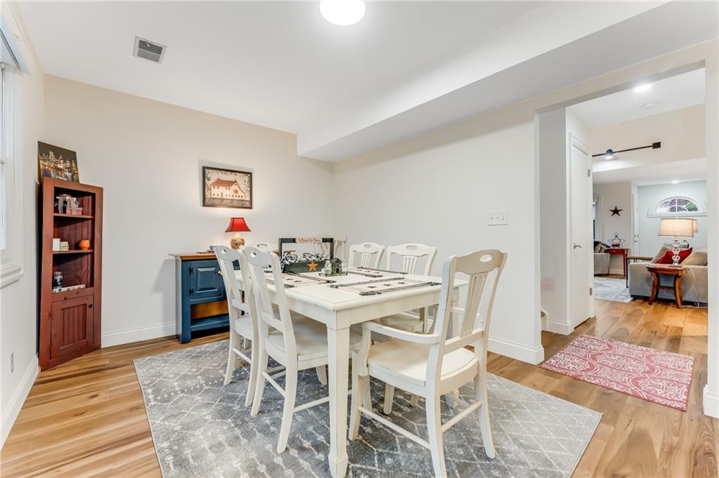 412 Chandler Place Pittsburgh, PA 15212 - Photo 16 of 49 a view of a dining room with furniture and wooden floor