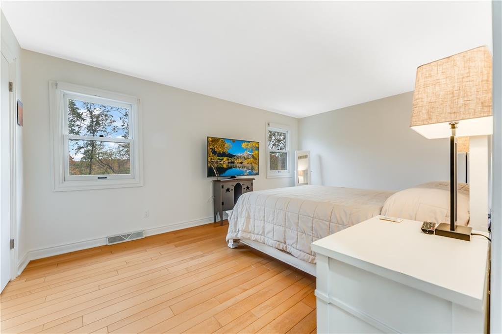 412 Chandler Place Pittsburgh, PA 15212 - Photo 21 of 49 a bedroom with a bed and a table