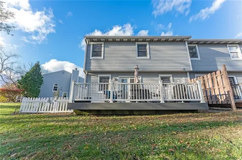 a view of a yard with large trees