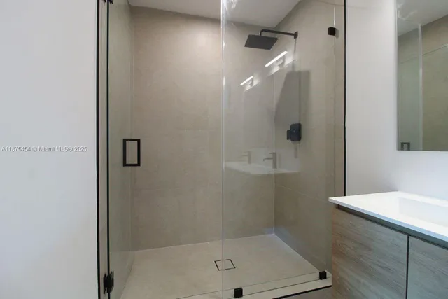 a bathroom with a bath tub and shower