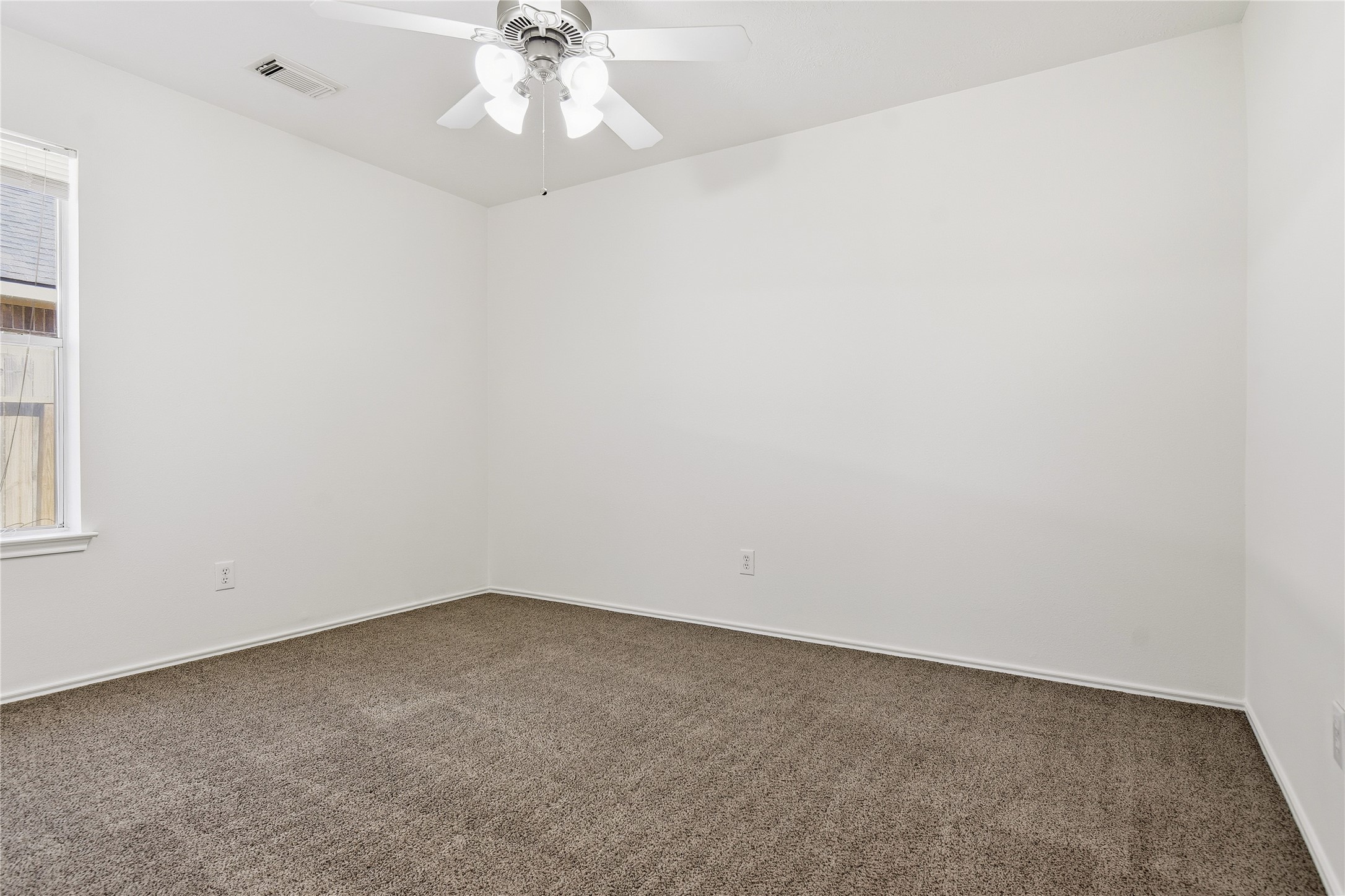 5417 Summer Spring Lane Rosharon, TX 77583 - Photo 12 of 16 an empty room with a window