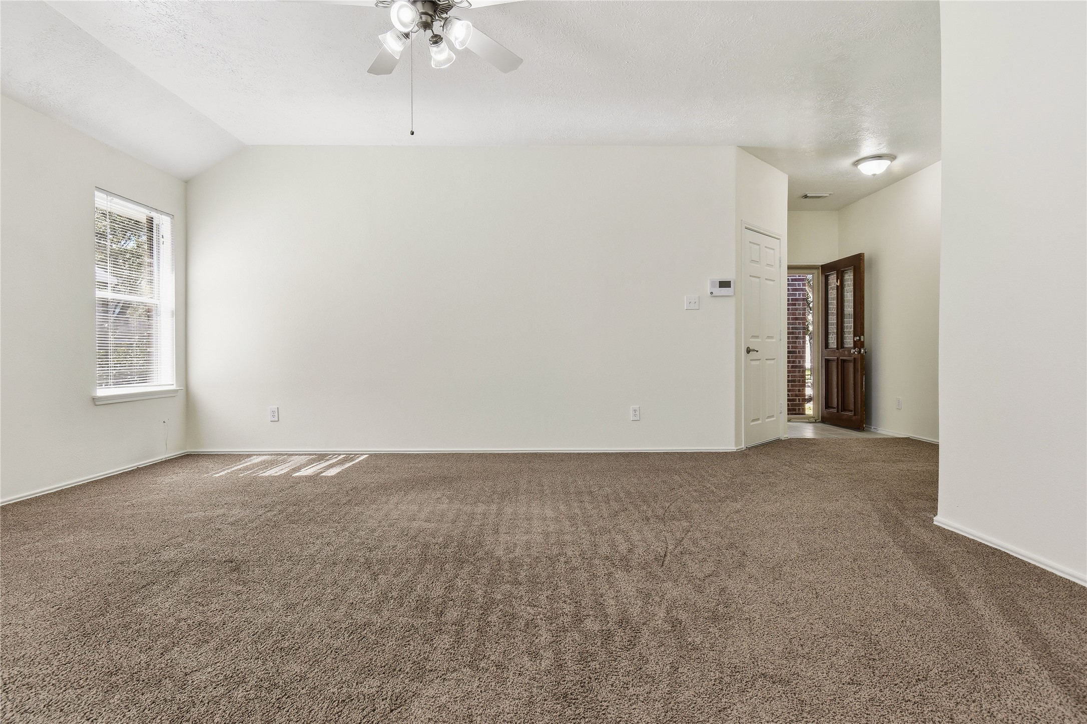 5417 Summer Spring Lane Rosharon, TX 77583 - Photo 2 of 16 a view of an empty room with a window