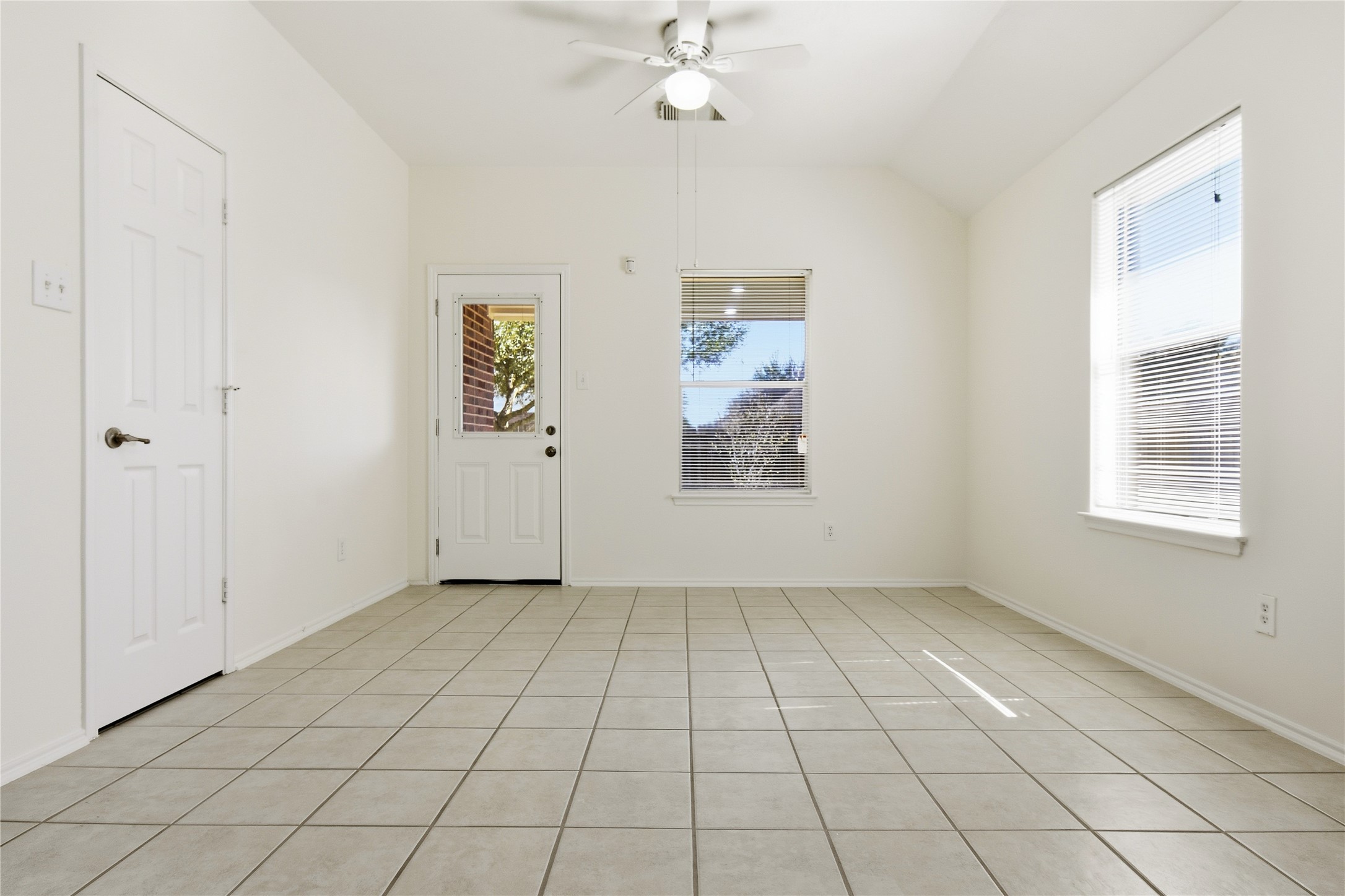 5417 Summer Spring Lane Rosharon, TX 77583 - Photo 4 of 16 an empty room with windows and fan
