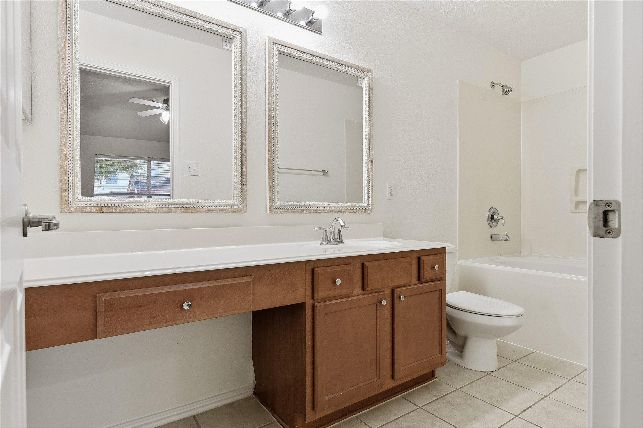 5417 Summer Spring Lane Rosharon, TX 77583 - Photo 8 of 16 a bathroom with a sink a toilet and a mirror