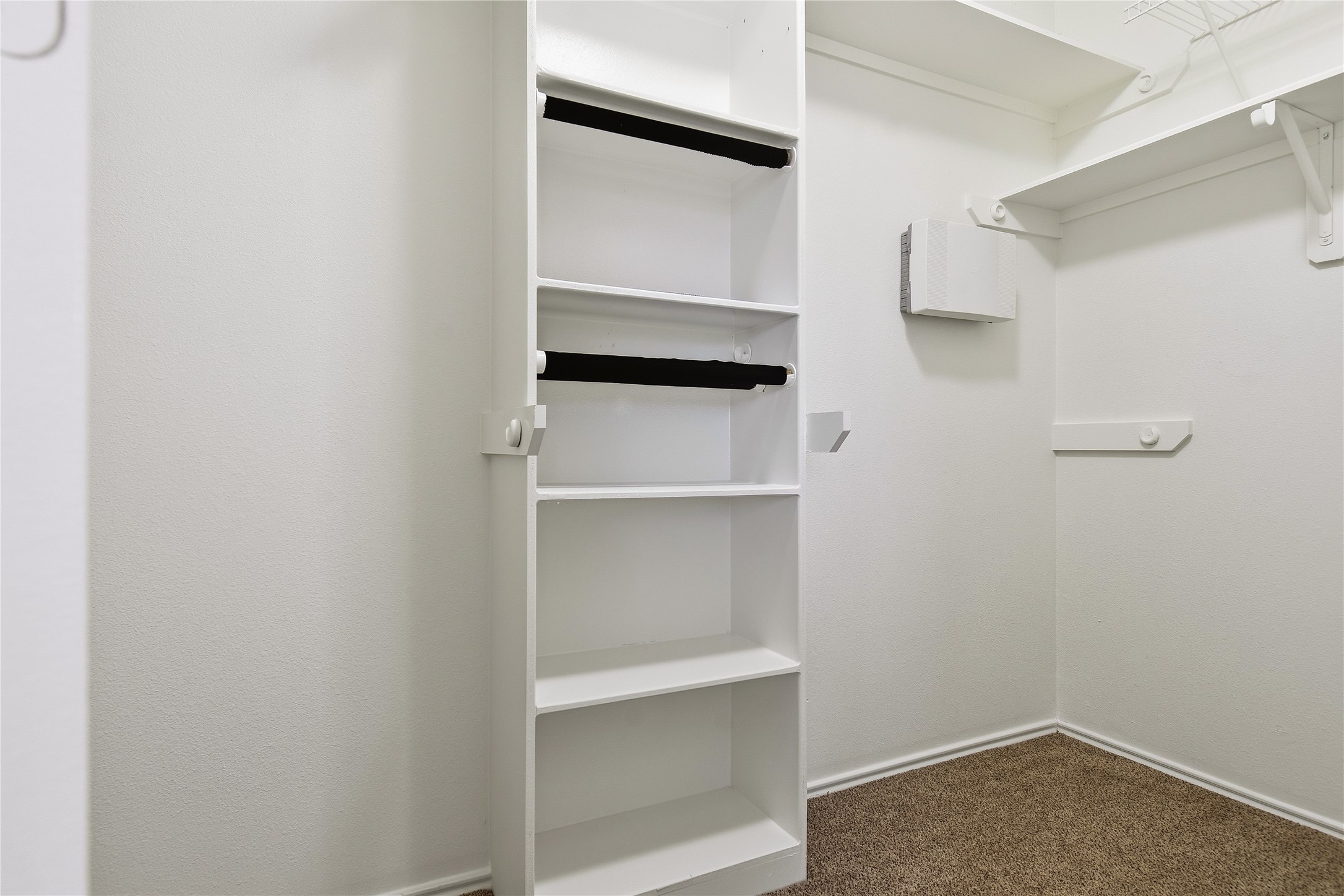 5417 Summer Spring Lane Rosharon, TX 77583 - Photo 9 of 16 a view of walk in closet with empty racks