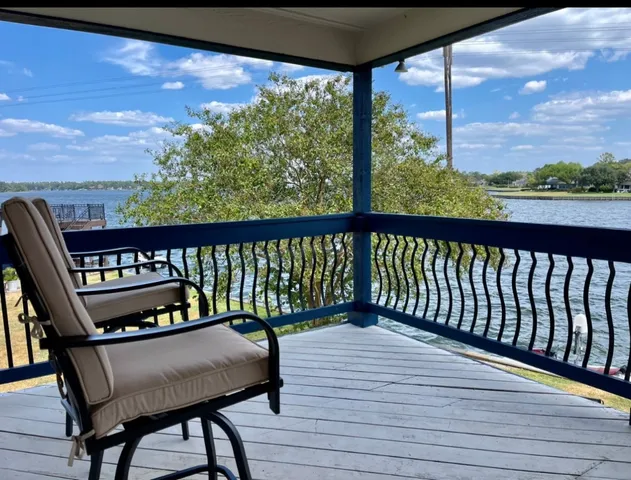a view of a balcony with wooden floor