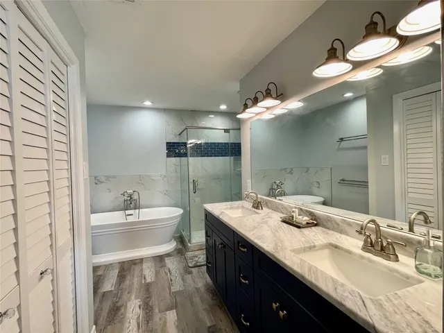 a bathroom with a bathtub and shower