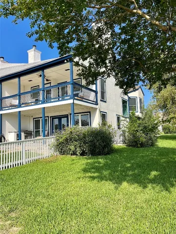 a view of swimming pool and deck in the backyard