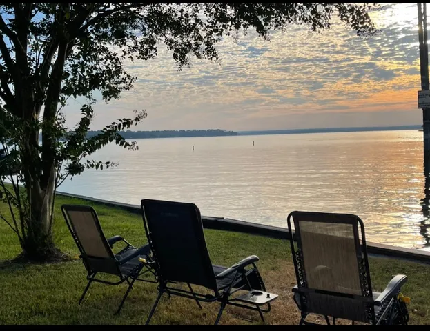 a view of a lake from a chairs