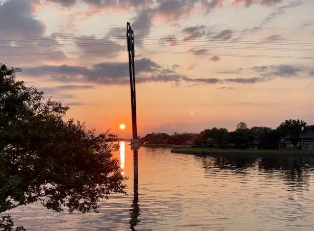 a kitchen with stainless steel appliances a sink and a refrigerator