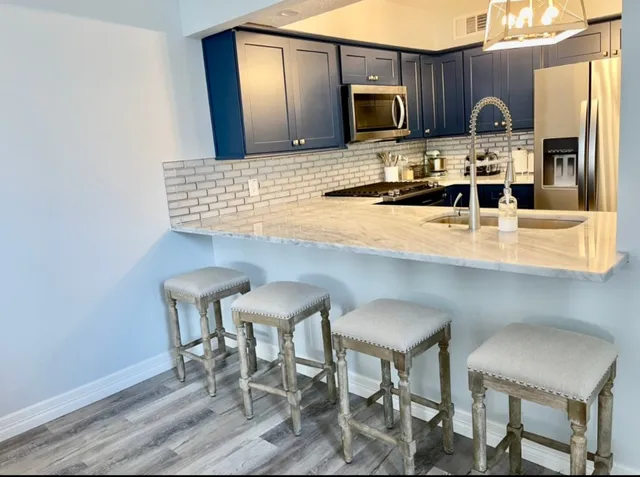 a bedroom with a bed and cabinet