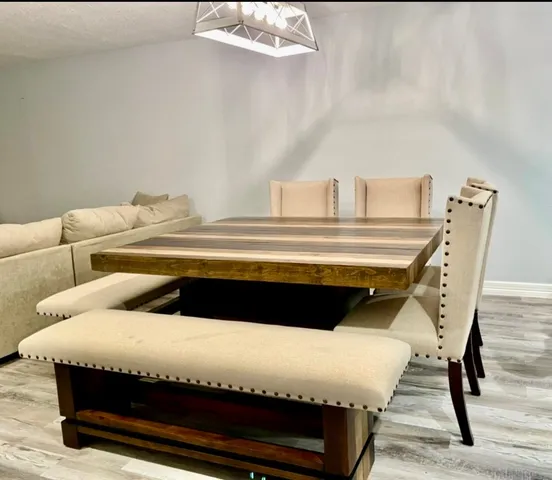 a kitchen with stainless steel appliances granite countertop a stove microwave and sink