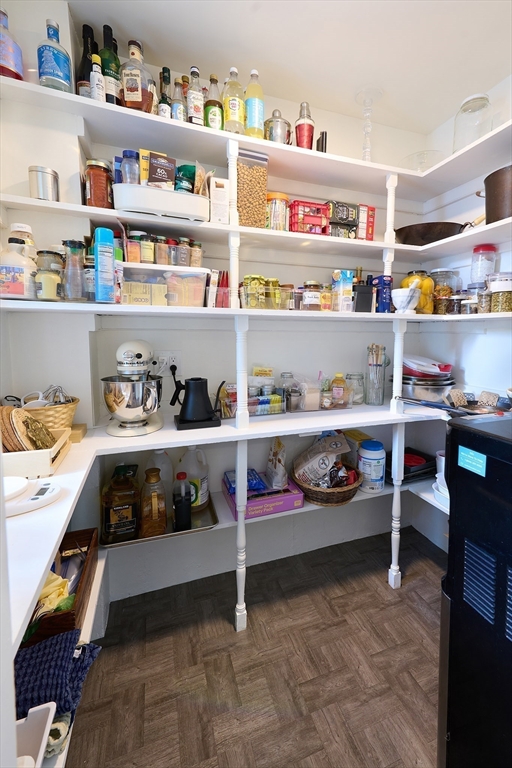20 Manning Street, Unit 2 Ipswich, MA 01938 - Photo 11 of 27 a bedroom with lots of white furniture and a shelf