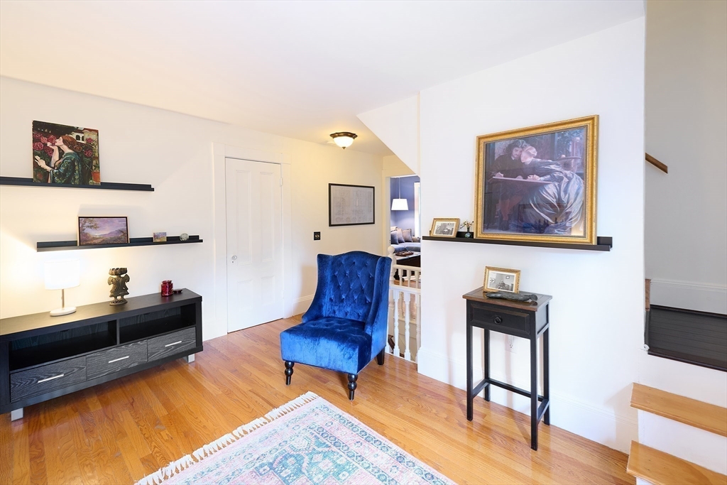 20 Manning Street, Unit 2 Ipswich, MA 01938 - Photo 12 of 27 a living room with furniture and wooden floor