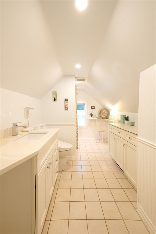 20 Manning Street, Unit 2 Ipswich, MA 01938 - Photo 19 of 27 a large white kitchen with a stove a sink dishwasher and a refrigerator with white cabinets