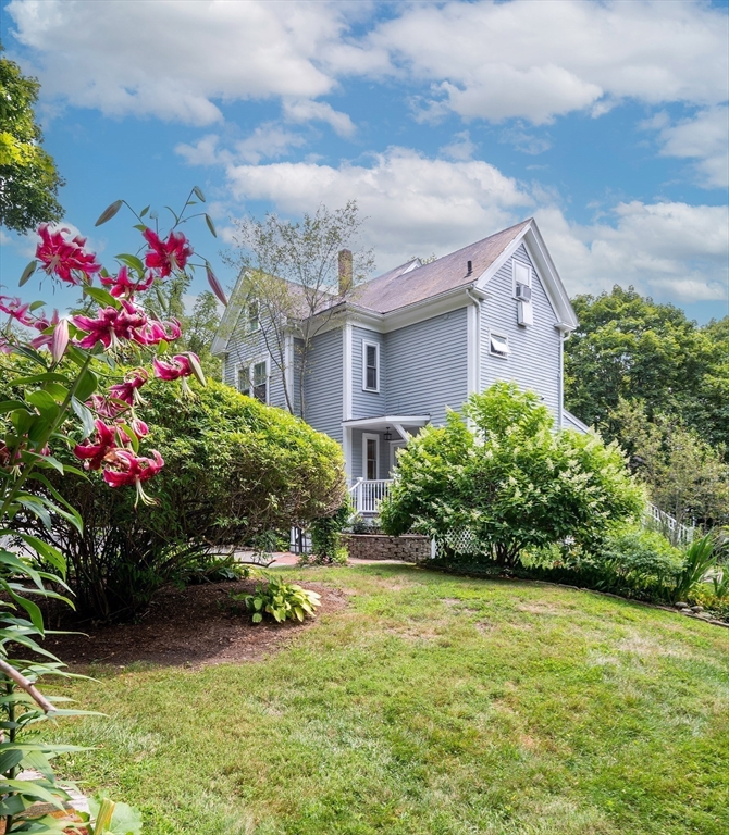 20 Manning Street, Unit 2 Ipswich, MA 01938 - Photo 2 of 27 a view of a garden with flowers and plants