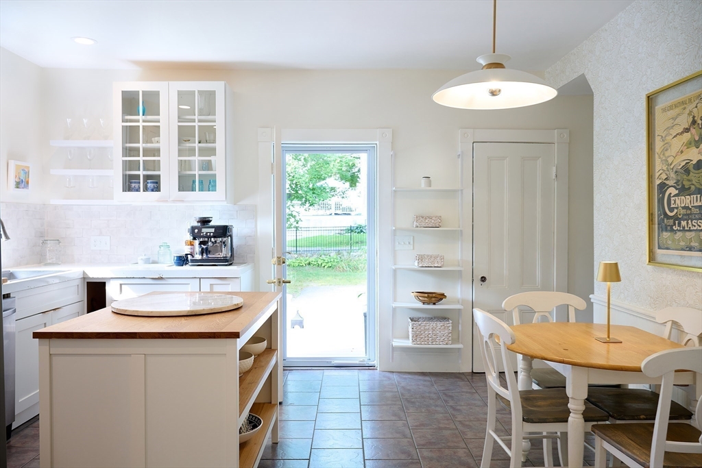 20 Manning Street, Unit 2 Ipswich, MA 01938 - Photo 7 of 27 a kitchen with a sink and chairs