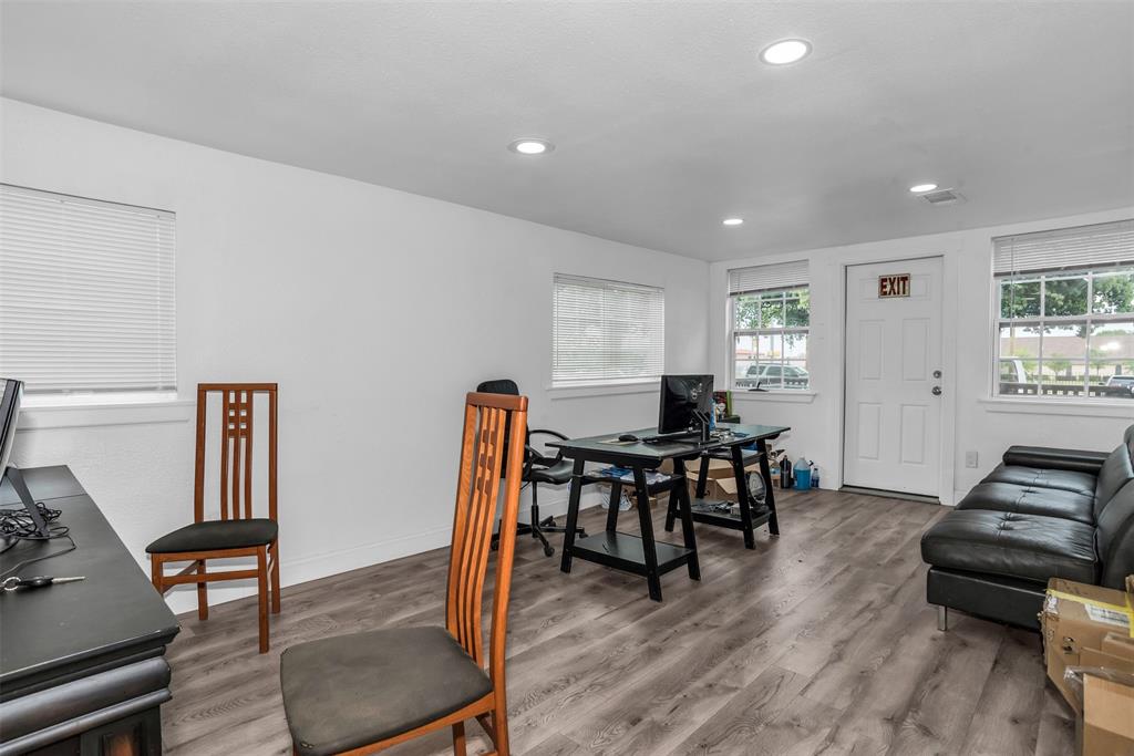 3410 House Anderson Road Euless, TX 76040 - Photo 7 of 18 Spacious room featuring light wood-finish flooring and multiple windows with blinds