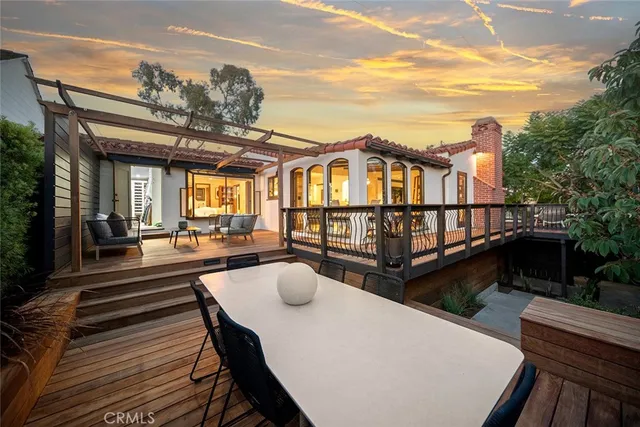 a view of a house with pool and wooden floor