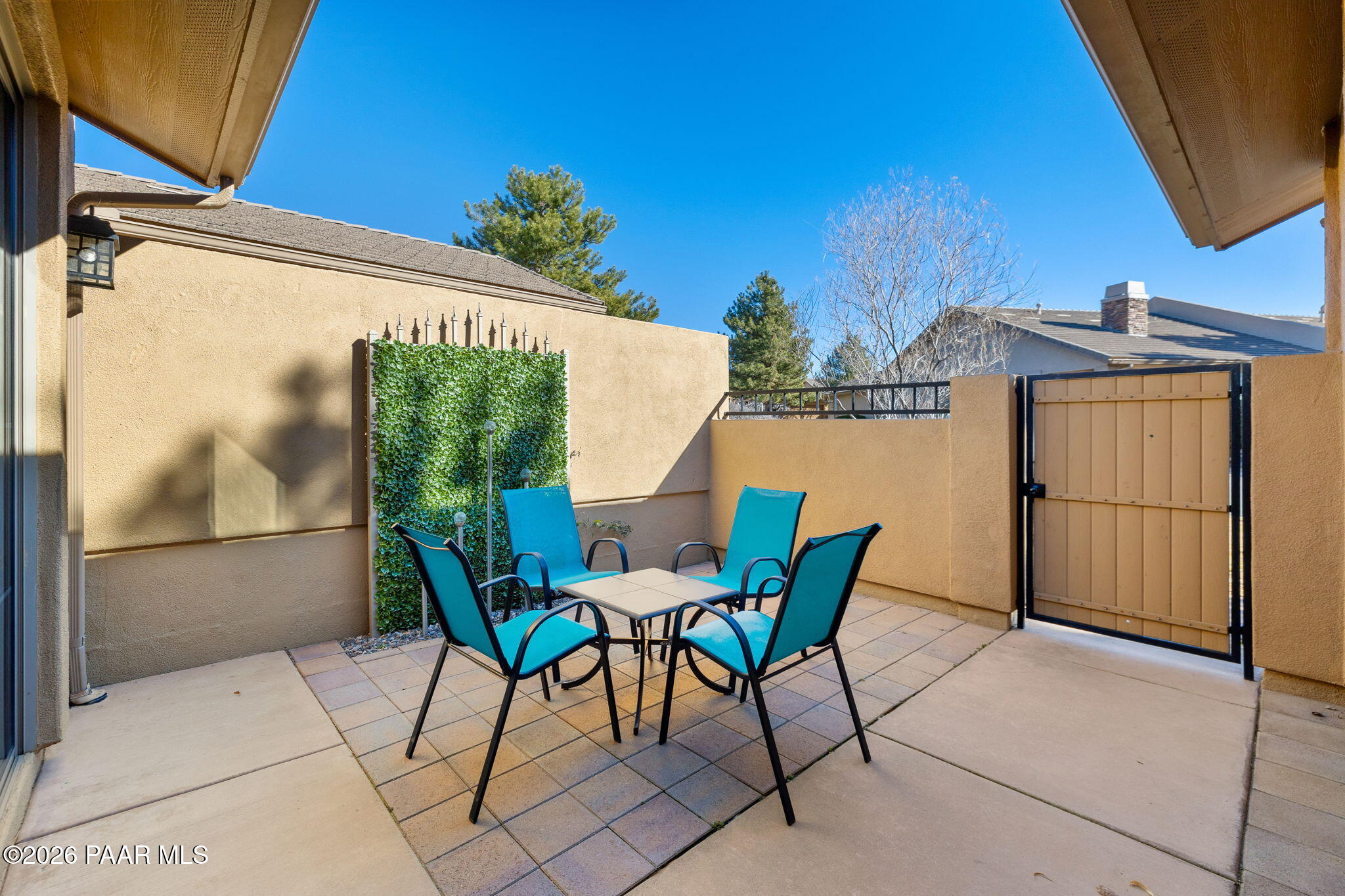 1242 Crown Ridge Drive Prescott, AZ 86301 - Photo 5 of 22 a view of a patio with table and chairs and potted plants