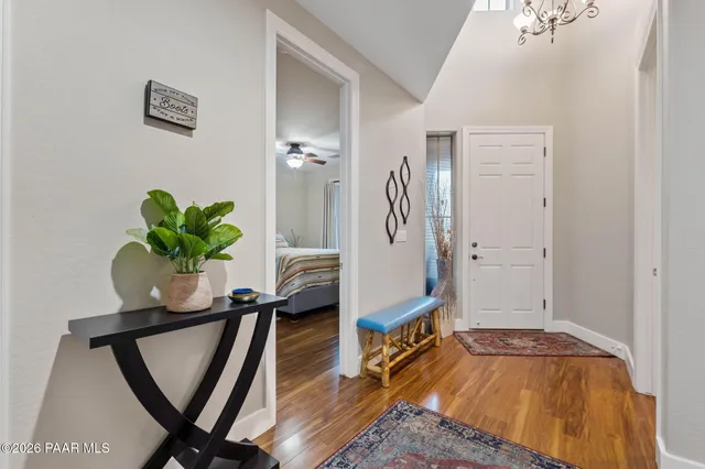 a bedroom with a bed and a potted plant