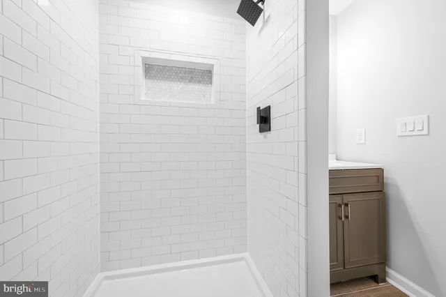 a bathroom with a bathtub and shower