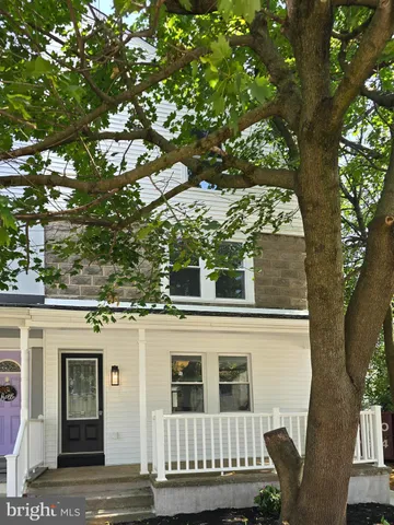 a view of a house with a tree