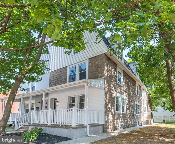 a view of a house with a tree