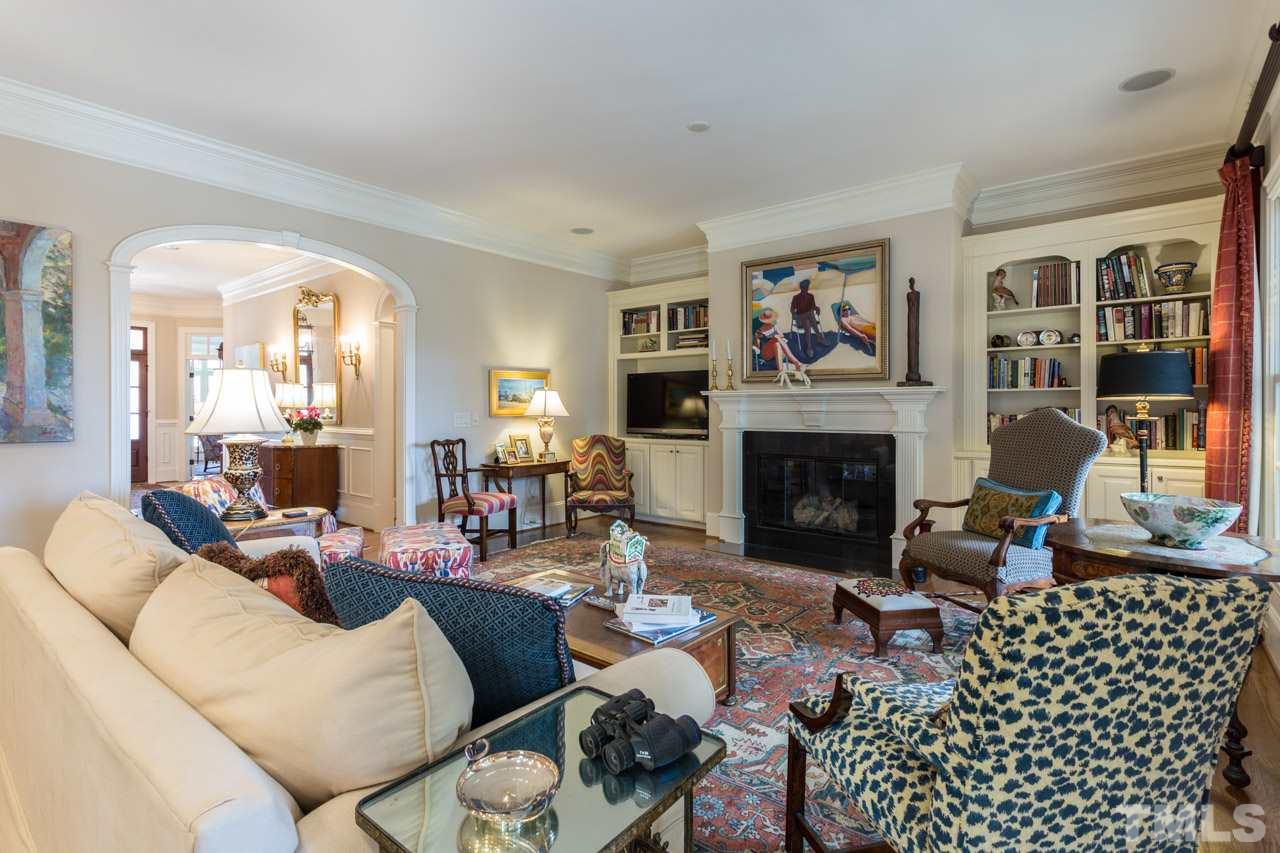 2308 Beechridge Road Raleigh, NC 27608 - Photo 16 of 27 a living room with furniture and a fireplace