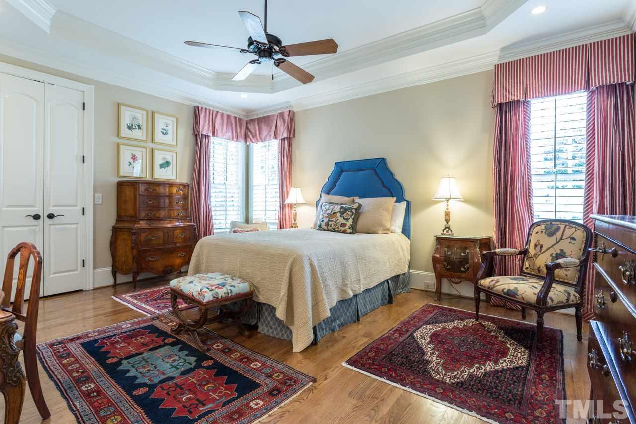 2308 Beechridge Road Raleigh, NC 27608 - Photo 19 of 27 a bed room with a bed and a couch