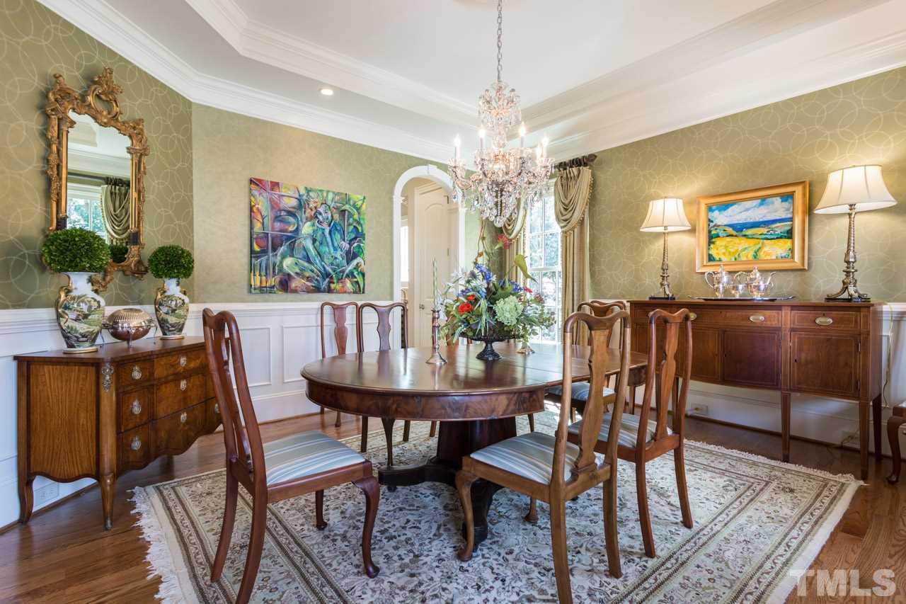 2308 Beechridge Road Raleigh, NC 27608 - Photo 8 of 27 a view of a dining room with furniture and chandelier