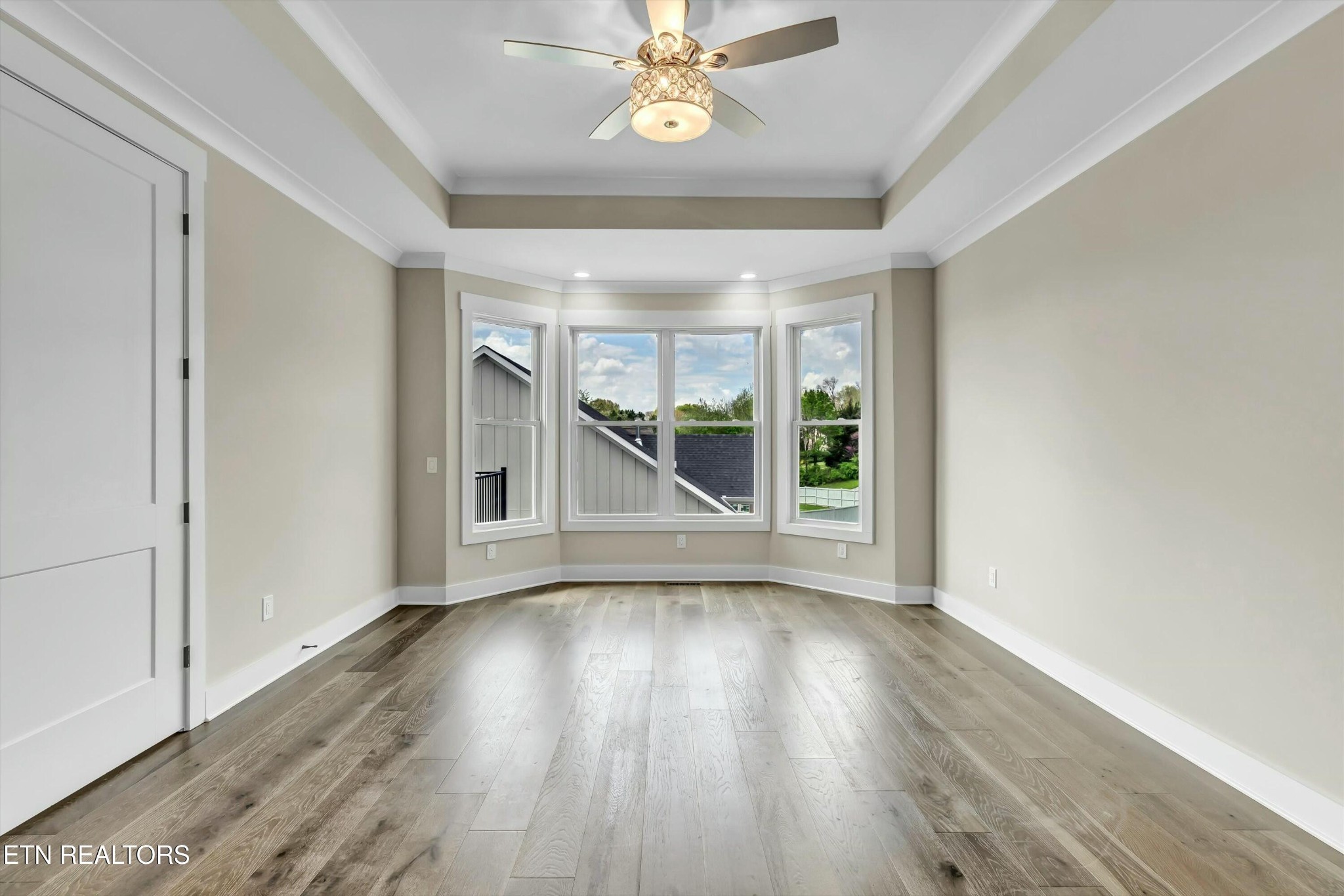 819 Anchor Vista Road Knoxville, TN 37934 - Photo 16 of 31 wooden floor in an empty room with a window