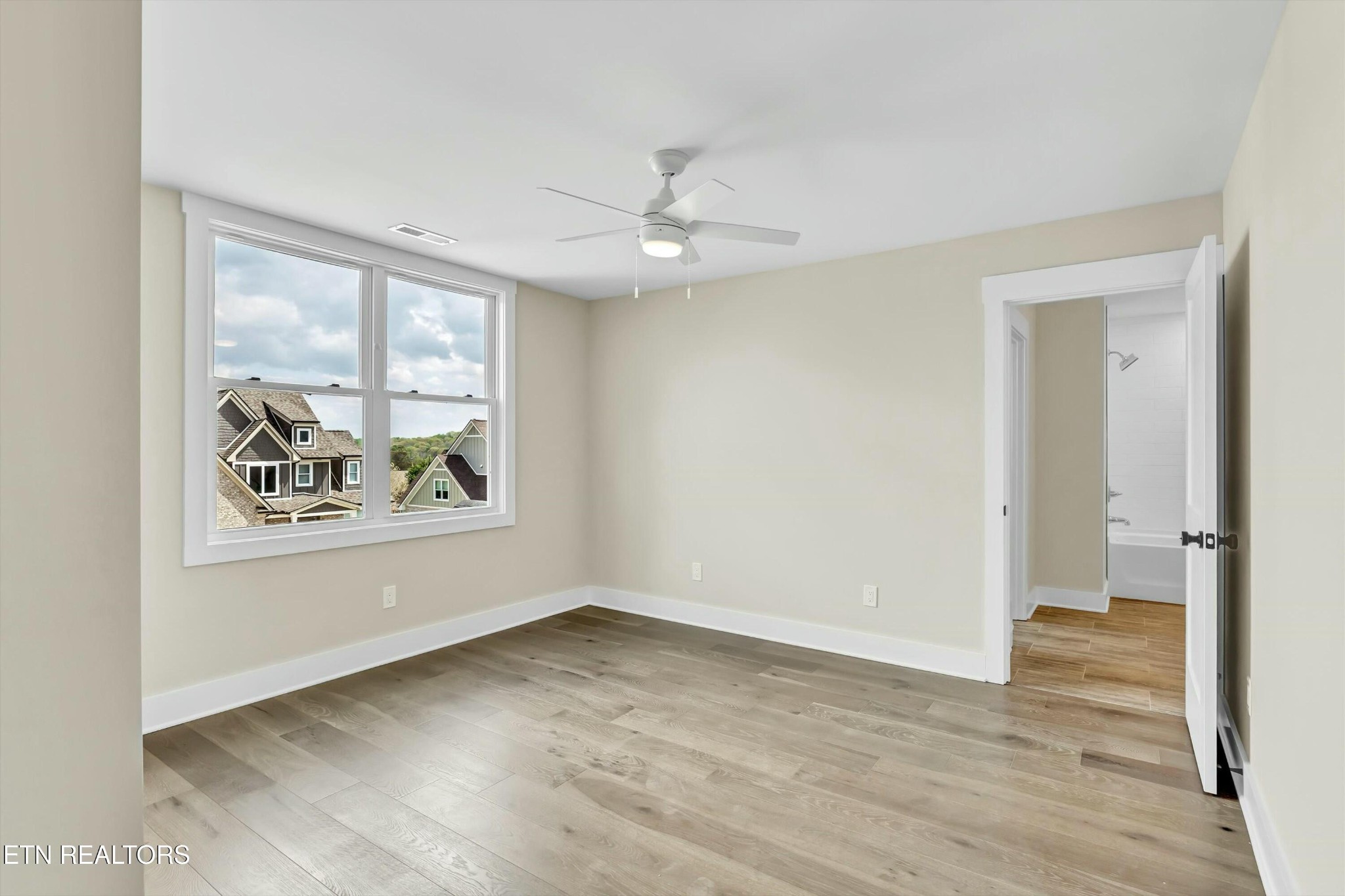 819 Anchor Vista Road Knoxville, TN 37934 - Photo 20 of 31 wooden floor in an empty room with a window