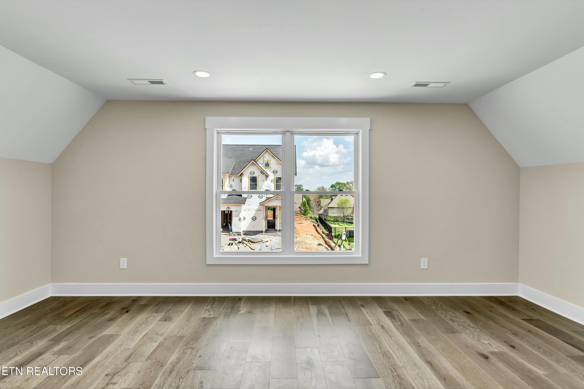 819 Anchor Vista Road Knoxville, TN 37934 - Photo 22 of 31 a view of an empty room with wooden floor and a window