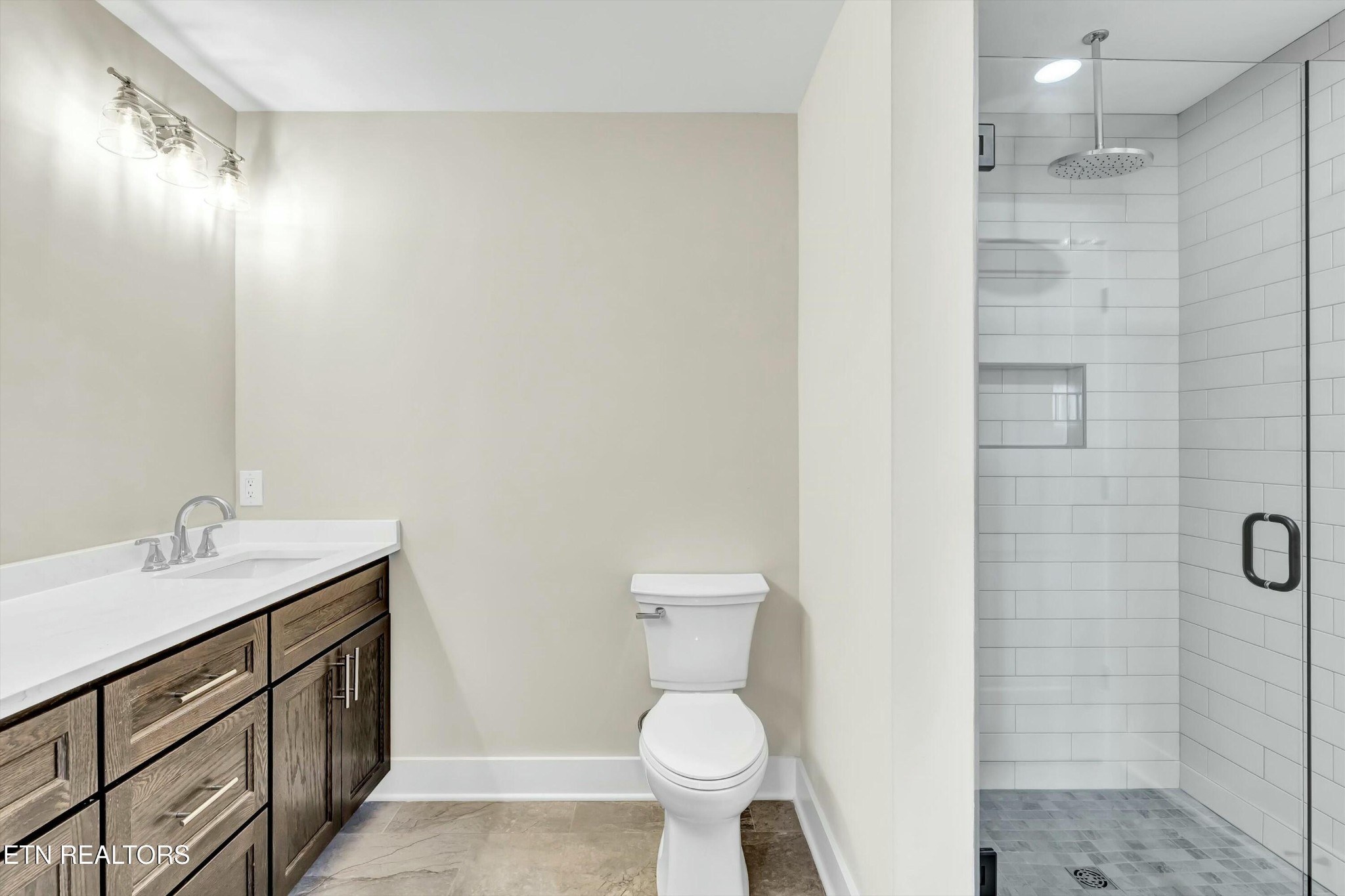 819 Anchor Vista Road Knoxville, TN 37934 - Photo 24 of 31 a bathroom with a granite countertop sink toilet and shower