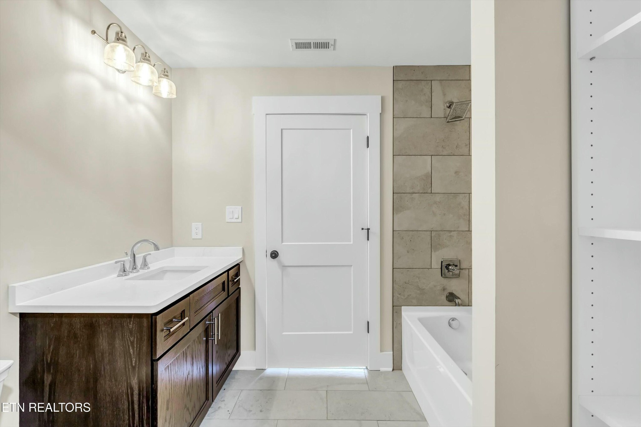 819 Anchor Vista Road Knoxville, TN 37934 - Photo 26 of 31 a bathroom with a tub sink shower and mirror