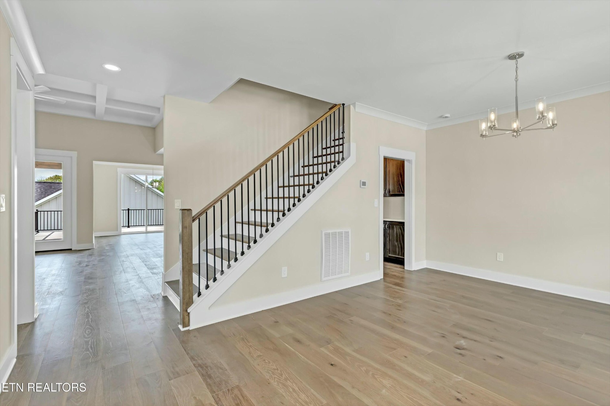 819 Anchor Vista Road Knoxville, TN 37934 - Photo 5 of 31 a view of a hallway with wooden floor and stairs