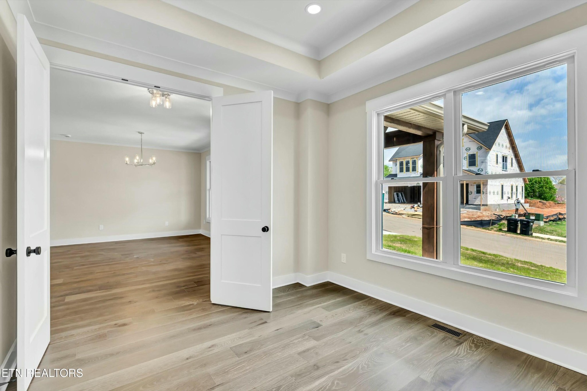 819 Anchor Vista Road Knoxville, TN 37934 - Photo 6 of 31 wooden floor in an empty room with a window