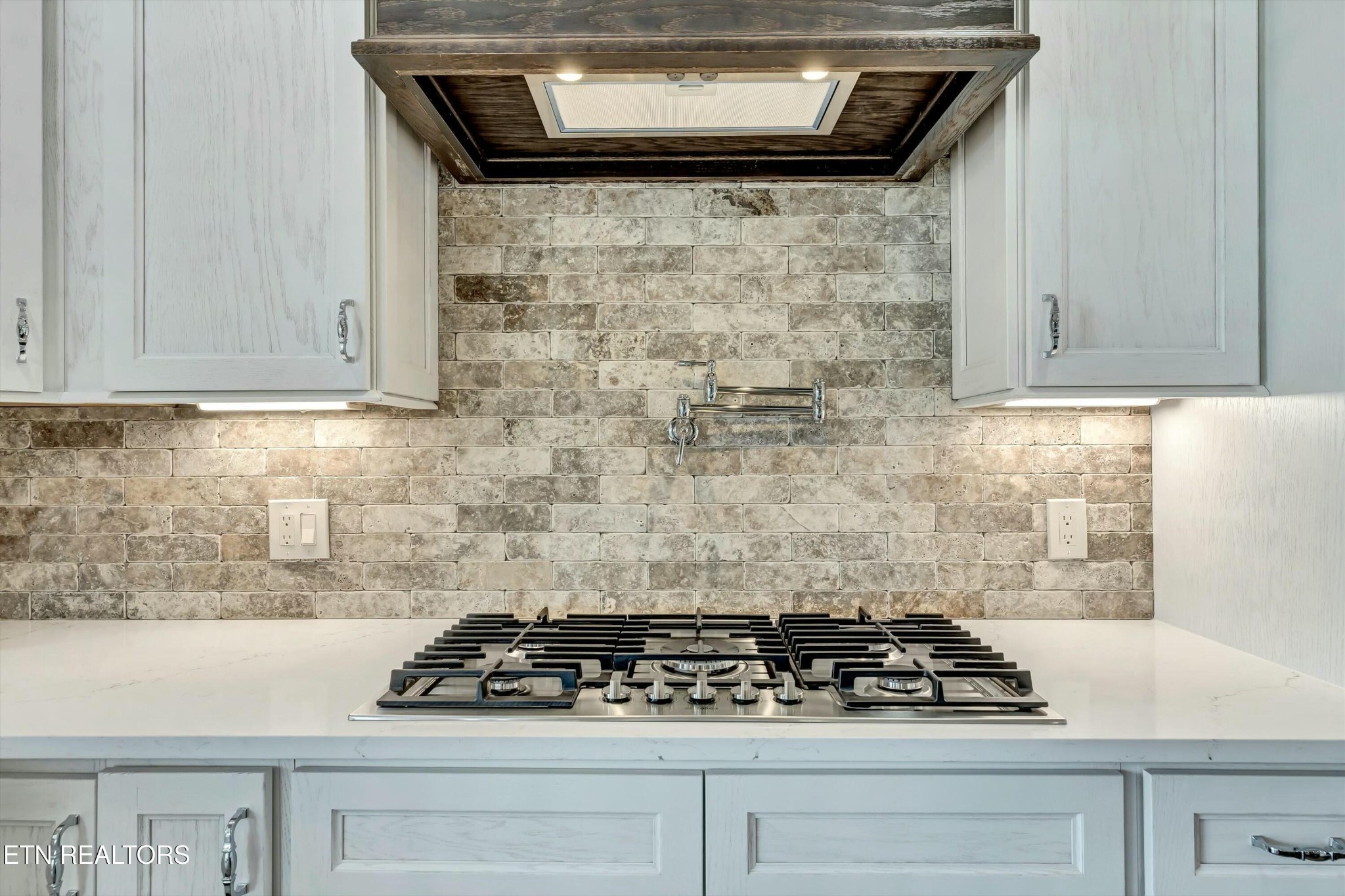 819 Anchor Vista Road Knoxville, TN 37934 - Photo 10 of 31 a kitchen with a stove and a refrigerator