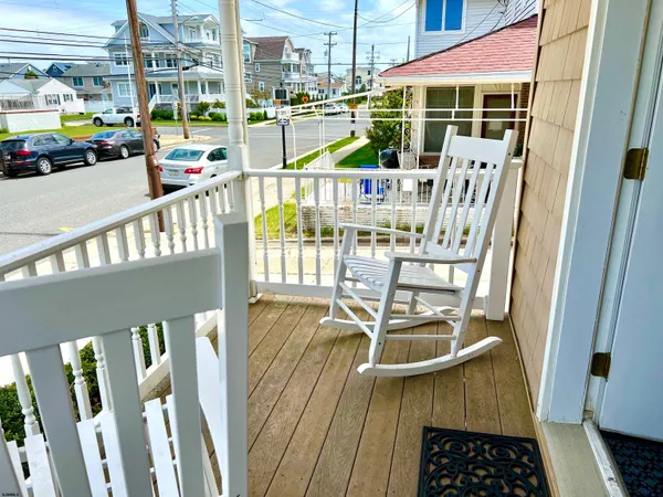 a view of a balcony with chairs