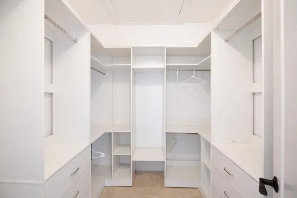 a view of an empty walk in closet