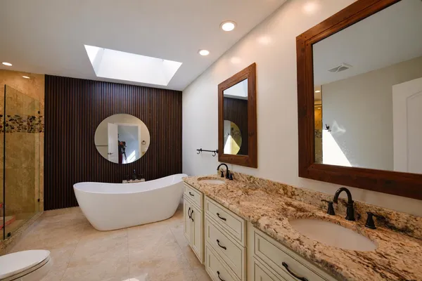 a bathroom with a double vanity sink and a mirror