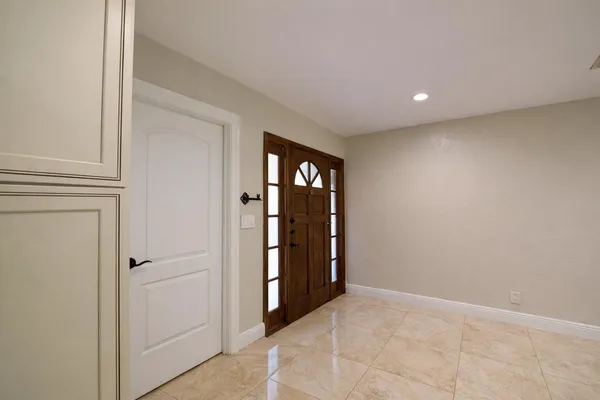a view of an empty room and window