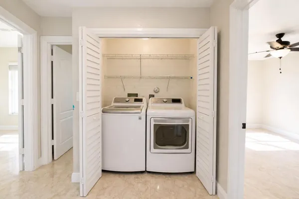 a utility room with dryer and washer